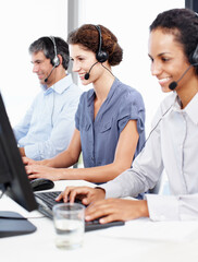Team, headset and smile in call center for customer service, telemarketing and diversity in office....