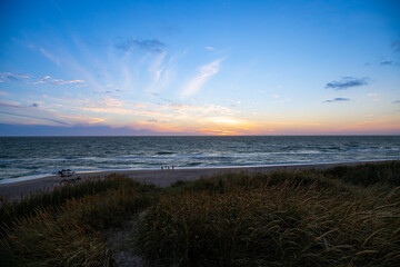Obraz premium Sunset on the beach of Denmark to the North Sea between dunes