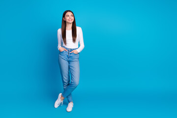 Full body photo of attractive teen woman posing look empty space dressed stylish white clothes...