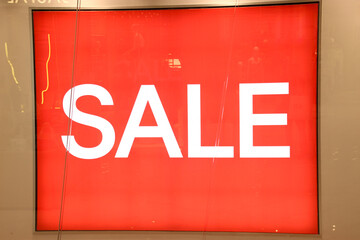 sale light shop display sigh with red background 