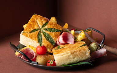 Cornbread slices with cannabis butter, with bacon and vegetables