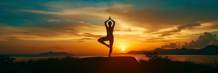 A silhouette person performing a yoga pose at sunset against a stunning backdrop of mountains, suggesting peace and mindfulness.