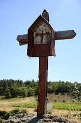 Wooden cross on the road