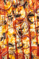 the macro composition of pizza for the menu. fresh ingredients are cheese, ham and tomatoes.