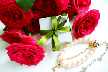 gift concept. beautiful gift boxes with bows and a bouquet of red roses