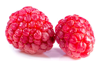 ripe raspberries on white background