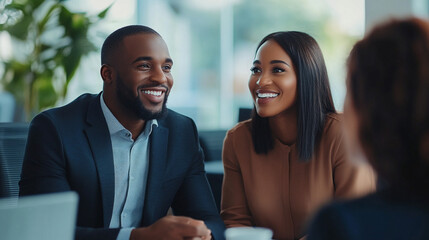 Happy couple having a meeting with a real estate.