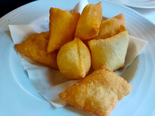 Golden Crispy Gnocco Fritto: Traditional Italian Fried Dough Appetizer on White Plate