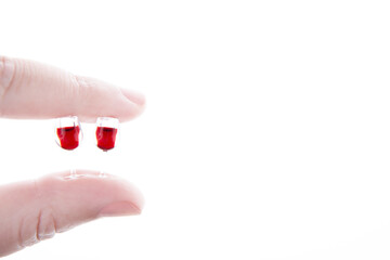 image of miniature wine glass hand white background 