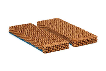 Evaporative cooling pad, made of corrugated cellulose materials with honeycomb-like structure, is used in evaporative air cooling systems to cool air through the evaporation of water, isolate on white