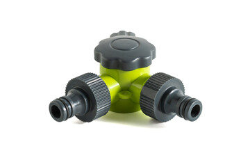 Garden hose splitter. It's a device used to split a single water source into two separate outlets. This type of device is commonly used in gardening, landscaping, and general outdoor water management