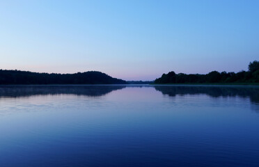 Sunset on the lake. Amazing sunset over the river. Sunset landscape.