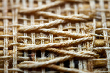 Extreme closeup of an old book from the side. Selective soft focus, shallow depth of field. Bibliophile, bookworm abstract background. Book binding detail.