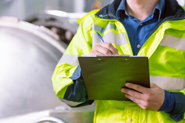 Technician engineer routine working monitor temperature in boiler room work in plant industry,...