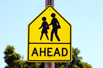 Road sign: School Ahead Sign