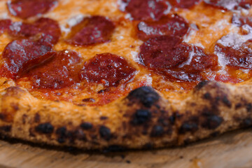 Pizza with salami and prosciutto. Meat pizza with cheese