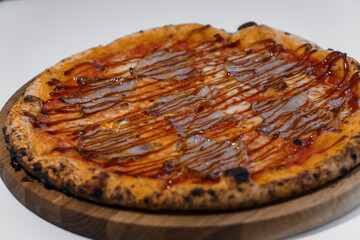 Pizza with salami and prosciutto. Meat pizza with cheese