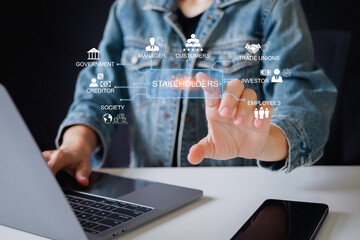 Stakeholders concept. Person touching stakeholders icon on virtual screen for business finance stakeholder investment management. Different stakeholders contact collaboration for company organization