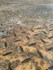 Rust of metals.Corrosive Rust on old iron with a hole. Rusted orange painted metal wall.