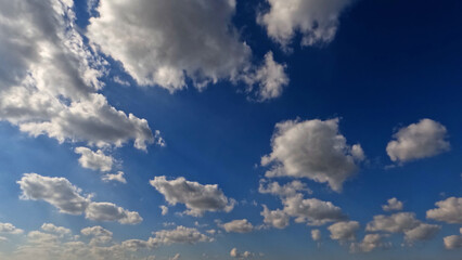 cute huge bright clouds in the blue sky backdrop - photo of nature