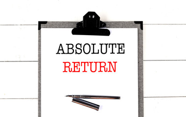 ABSOLUTE RETURN text on clipboard on white background