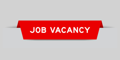 Red color inserted label with word job vacancy on gray background