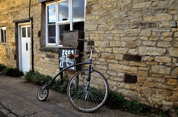 The penny farthing bicycle with seat.