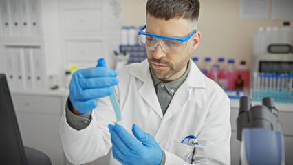 A young hispanic man in a lab assesses a test tube, portraying a professional scientific research setting