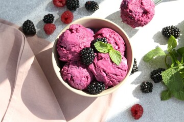 Delicious blackberry sorbet, mint and fresh berries on grey table, flat lay