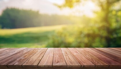 weathered, empty wooden tabletop rests serenely against a natural background of soft, earthy tones. The table&rsquo;s surface, with its rustic charm, blends harmoniously with the surrounding organic environ