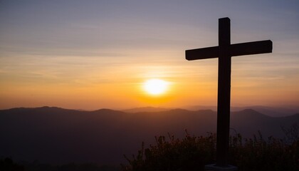 silhouette of a wooden cross stands prominently against a breathtaking sunset backdrop on a mountain. The dramatic interplay of light and shadow highlights the cross, creating a serene and sacred atmo