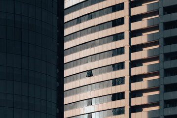 Fototapeta premium many windows and walls facade of a modern skyscraper without people