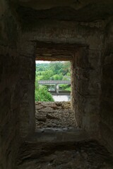 Old Ladoga, Russia, July 8, 2024. An embrasure in the fortress wall overlooking the bridge.                               