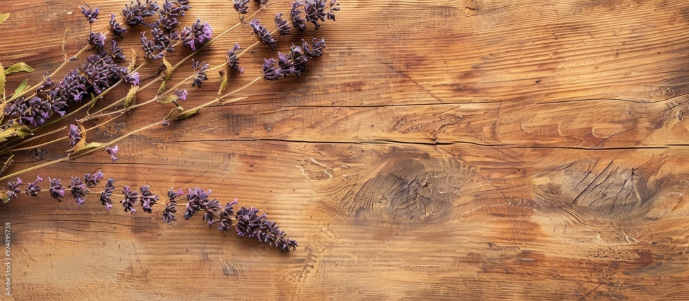 Poster Wooden table with a dried salvia branch for a restaurant menu background suitable for inserting text on a copy space image