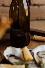 Elegant wine bottle with oysters and lemon, perfect for luxury dining and fine dining concepts