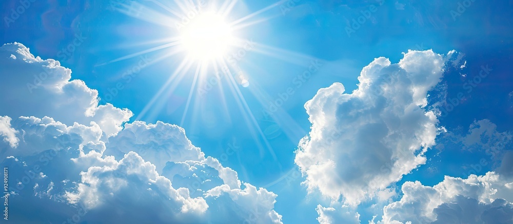 Poster Sunny summer sky with fluffy white clouds and ample copy space image available