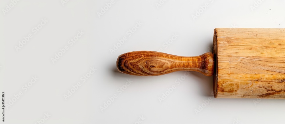 Poster Wooden rolling pin on a white background with space for text or graphics in the image. Creative banner. Copyspace image