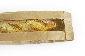 Freshly baked French baguette in a brown paper bag isolated on a white background.Loaf of white bread  wrapped in eco-friendly sustainable brown paper bag. Copy space. With clipping path...