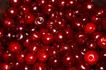 Background texture - dark and bright red ripe cherries