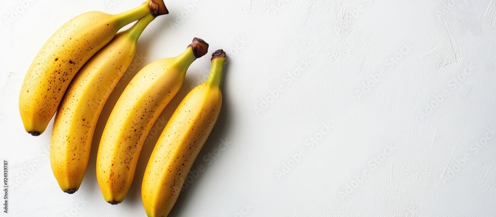 Fototapete fresh ripe bananas set against a white background vegetarian theme. with copy space image. place for