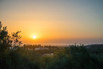 Fototapeta premium Sunrise over the sea from the hills of Puglia, Italy
