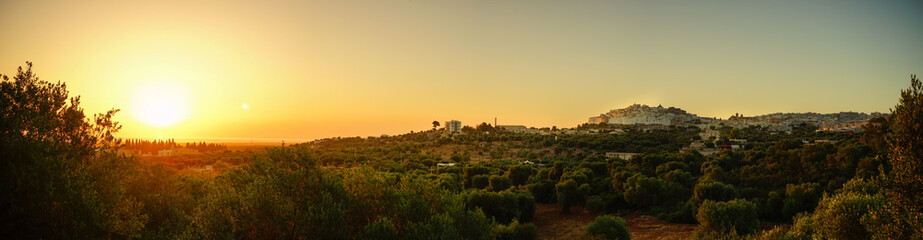 Panoramic sunrise over Ostuni village in a summer morning, Puglia, Italy