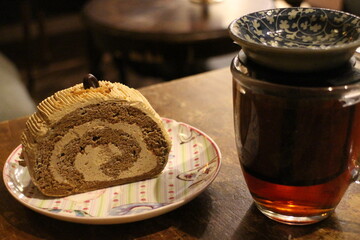 Mocha roll cake and hot tea in Frankfurt, Germany