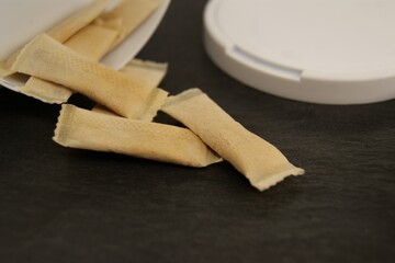 Packaging and nicotine pads on a dark background. 