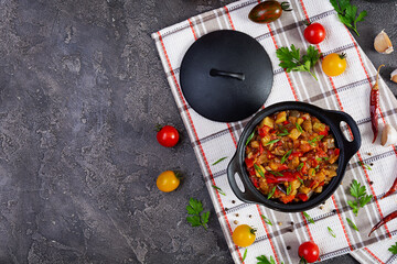 Stewed vegetables with tomato sauce and herbs. Spicy vegetable stew