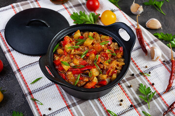 Stewed vegetables with tomato sauce and herbs. Spicy vegetable stew