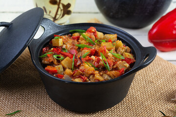 Stewed vegetables with tomato sauce and herbs. Spicy vegetable stew