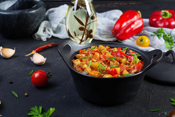 Stewed vegetables with tomato sauce and herbs. Spicy vegetable stew