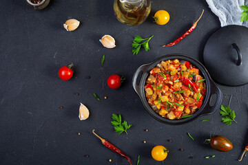 Stewed vegetables with tomato sauce and herbs. Spicy vegetable stew
