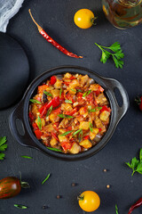 Stewed vegetables with tomato sauce and herbs. Spicy vegetable stew